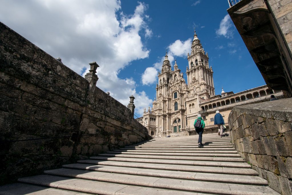 pilgrims arriving at Santiago de Compostela cathedral Camino de Santiago JWT travel tours